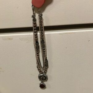 Intricate beautiful beaded necklace with amber stone and adjustable length clasp